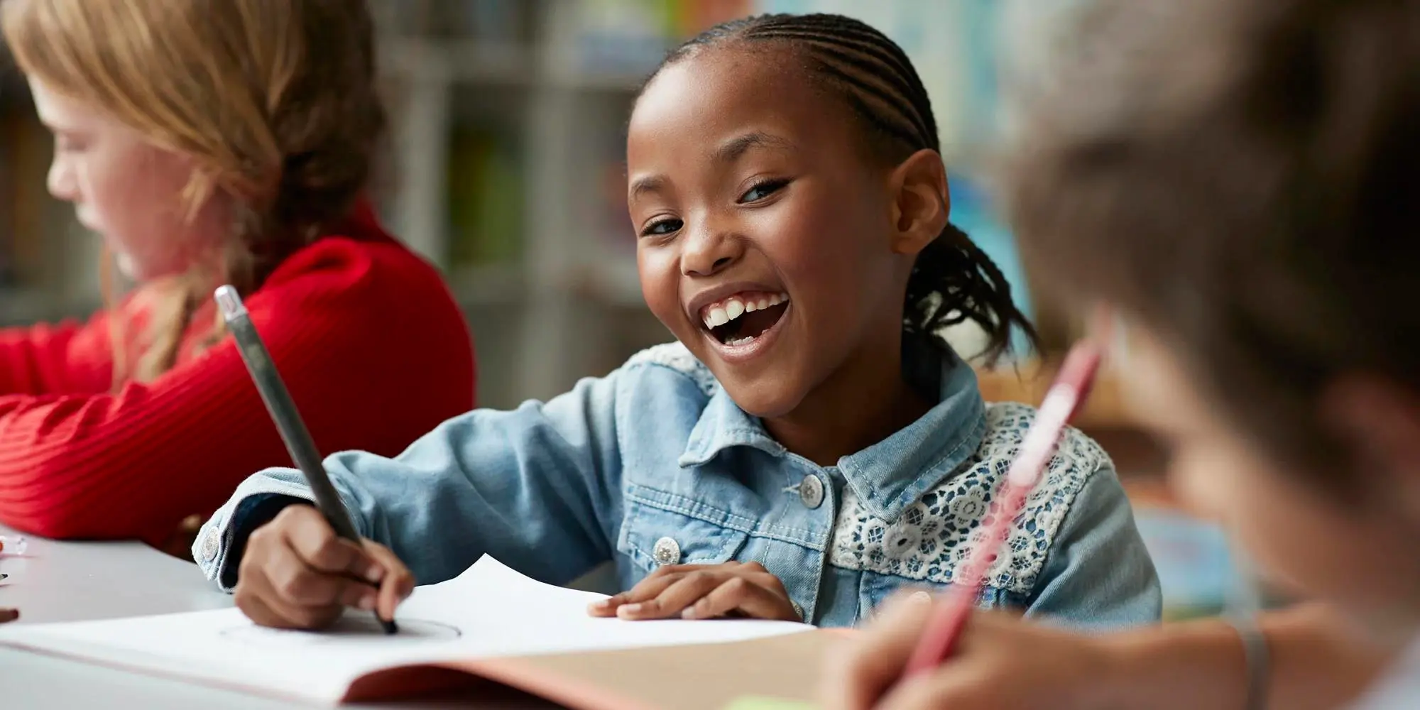 Smiling student in classroom representing educational empowerment